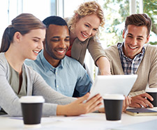 coworker showing her team something on a tablet