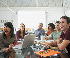 Coworkers are smiling in a meeting